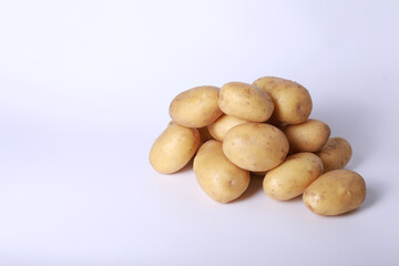 Raw potatoes on a white background
