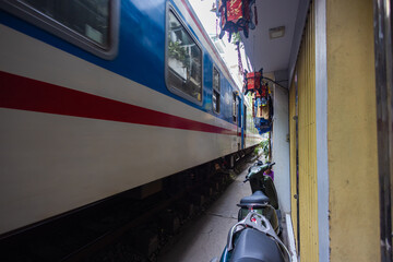 Hanoi, Vietnam - May 28, 2023: Train Street in Hanoi is a narrow, bustling lane with tracks. Close...