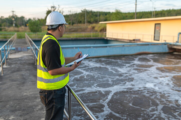 Environmental engineers work at wastewater treatment plants,Male plumber technician working at water supply