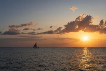 Foto op Plexiglas Silhouette of boat at sunset, Zanzibar in Tanzania. © robertobinetti70