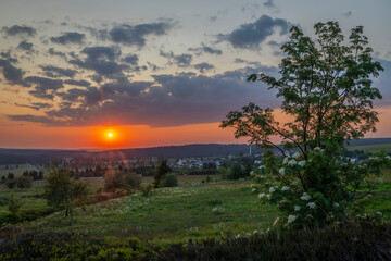 Color evening meadow near Bozi Dar village with sunset