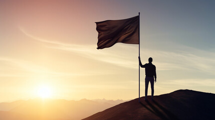 Silhouette of businessman holding flag on the top of mountain with over blue sky and sunlight. It is symbol of leadership successful achievement with goal and objective target