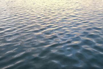 a large body of water with ripples
