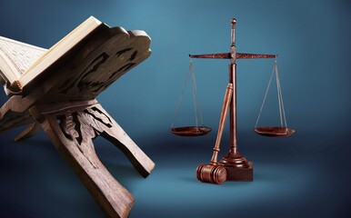 law concept, wooden gavel and holly koran