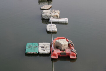 raft and floating boxes on water