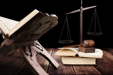 law concept, wooden gavel and holly koran