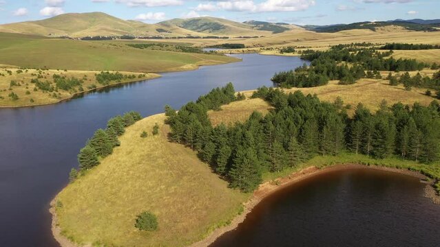 Aerial view of  of Zlatibor's lake nestled rolling meadows