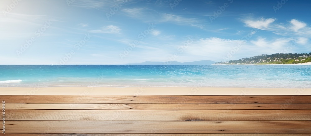Poster a wooden table or pier is shown in the presence of a sunny beach and sea in the background. provides