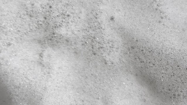 Foam bubble from soap or shampoo top view. Soap foam texture surface for white abstract background. Detergent foam. Copy space, banner. For laundry, cleaning service. Bathroom, clean, wash concept	
