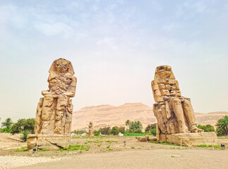 Large stone statues of the gods of the pharaohs, near the temple of Hatshepsut.
