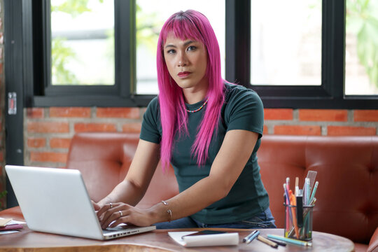 Asian transgender Pink Hair Working on Design Business Gender equality LGBTQ+ concept