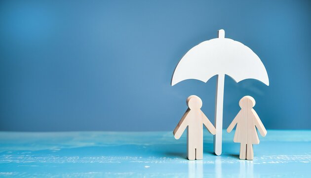 Umbrella symbol and people model on the table. concept of safety protection and health insurance, family security, health care day, car insurance

