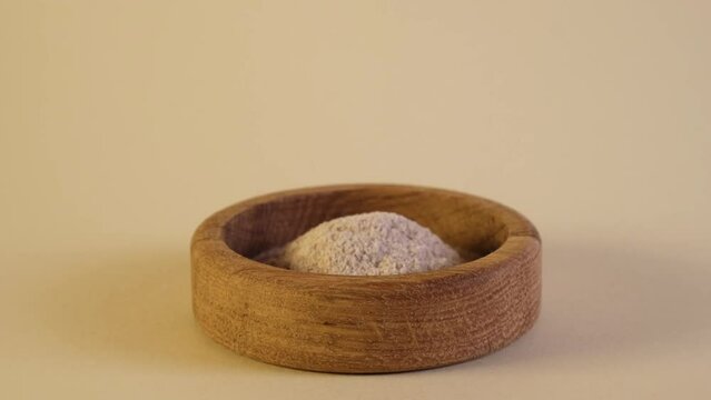 Psyllium husk powder or Psyllium flour, close-up. Video, Slow motion. Natural supplements to aid weight loss. Crushed Ispaghula seeds may lower blood glucose levels in people with type 2 diabetes.