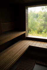 Interior of wooden Finnish sauna. classic wood sauna.