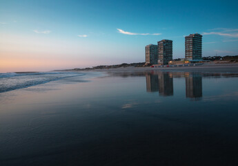 Ofir Towers reflected in the low tide sea during Sunset, Ofir, Braga, Portugal.