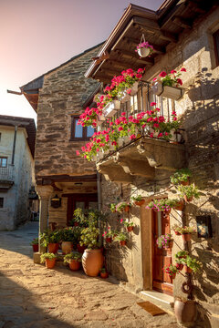 Typical street of the historic center of Puebla de Sanabria, Zamora, Castilla y Leon, Spain with balconies with flowers