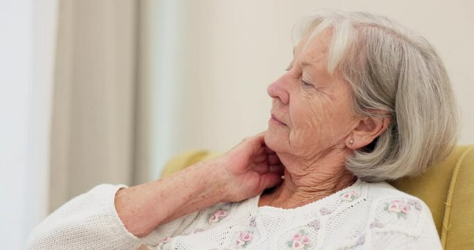 Senior, woman and neck pain on a sofa with arthritis, discomfort and fibromyalgia in her home. Shoulder, stress and elderly female in a living room with muscle injury, inflammation or posture fail