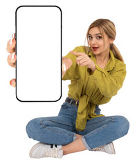 Point index finger mobile phone mock up, full length body view young blonde girl sit on floor point index finger mobile phone mock up. Holding showing smartphone. recommending application, banner.