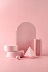 Pink background for product presentation with concrete podiums of geometric shapes. Empty podiums. Mockup.