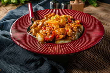 Chicken fricassee with noodles and salad.