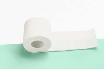 Roll of toilet paper on colorful background