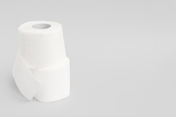 Rolls of toilet paper on grey background