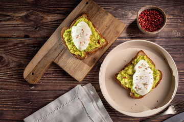 Wholemeal toast with avocado and poached egg.