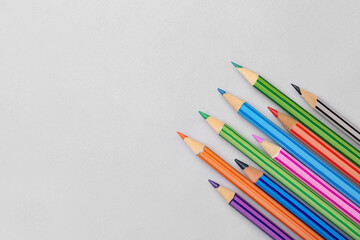 Set of color pencils on light background