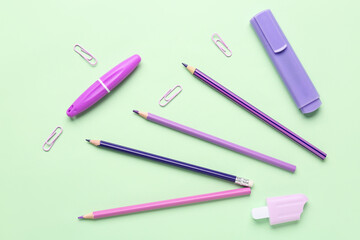 Set of stationery with pencils on color background