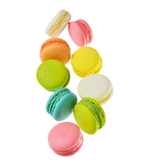 Flying sweet macaroons on white background