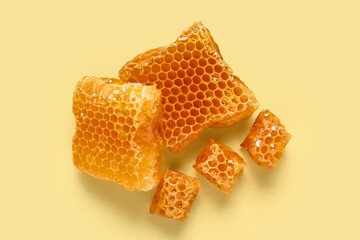 Sweet honeycombs on yellow background