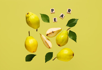 Word PEAR with fresh fruits and leaves on green background