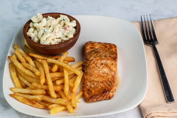 bourbon salmon  with  fries and macaroni salad