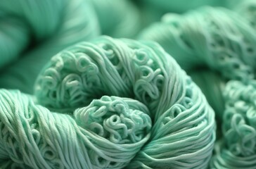 Close up of green knitting yarn as a background. Macro texture.