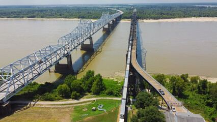 Old Vicksburg Bridge or Mississippi River Bridge with freight train crossing all-steel railroad truss river, a cantilever bridge carrying one rail line across the Mississippi River, USA