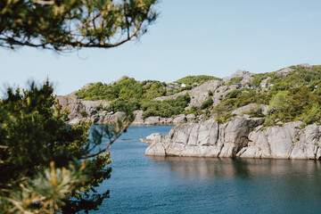 Fototapeta na wymiar Beautiful fjord surrounded by rocky cliffs in Norway 