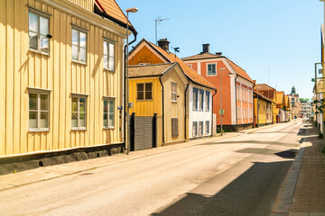 Fototapeta na wymiar historic wooden houses at Hamngatan in the old city of Västervik, Sweden