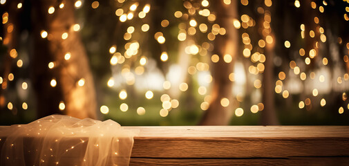 Empty Wood table top with decorative outdoor string lights hanging on tree in the garden at night time. Empty wood table top with blur bokeh light background. digital ai