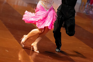 a couple dance a Latin dance. the legs of a dancing couple