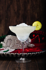 Margarita cocktail and mariachi hat in the background. Mexican symbols.