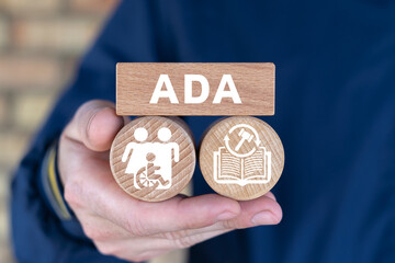 Man holding wooden blocks with icons and abbreviation: ADA. Concept of ADA Americans with...