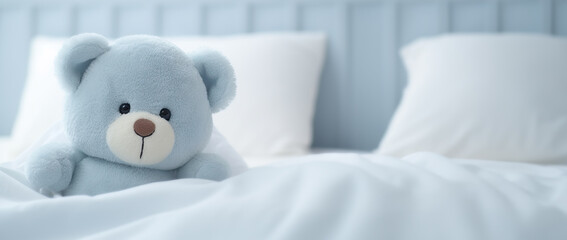 Get Well Hugs: Comforting Blue Teddy Bear Stuffed Toy Sitting on Bed, Sending Warm Wishes for a Speedy Recovery.