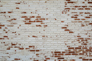 old white paint on red brick wall use as grounge background
