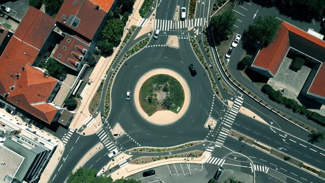 Aerial top down view of a three road roundabout traffic on Montelimar, France