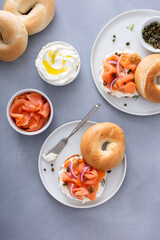 Plain bagel with salmon and cream cheese with fresh dill and capers