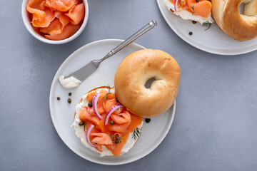 Plain bagel with salmon and cream cheese with fresh dill and capers