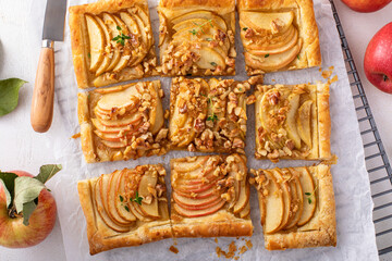 Puff pastry apple galette with pecan nuts and caramel syrup