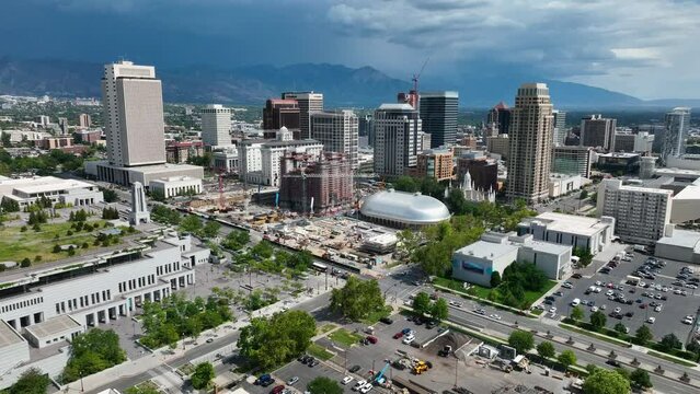 Aerial city center Salt Lake City Utah LDS Church buildings fast. City downtown business religious headquarters. The Church of Jesus Christ of Latter-day Saints temple Square. Tourist destination.