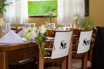Table for a wedding party and celebration, in the image the chairs waiting for the bride and groom