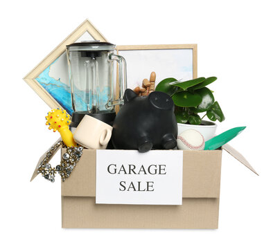 Different stuff in box with sign Garage Sale isolated on white